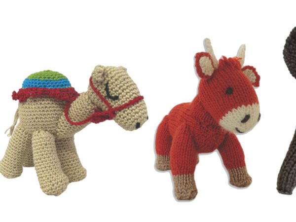 Animal knit toys on white background