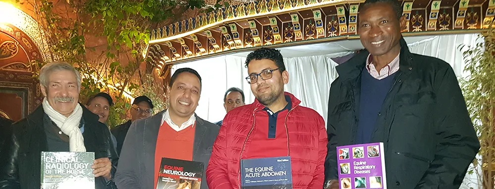 four SPANA vets with their books