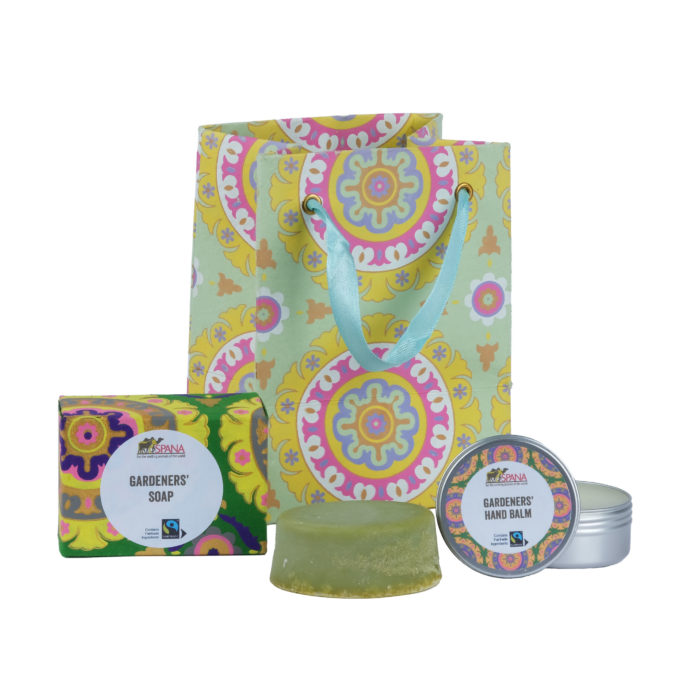 Green patterned gift bag with a gardeners soap and gardeners hand balm