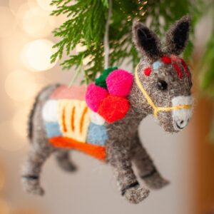 Felt donkey decoration hanging from a Christmas tree