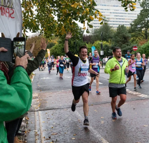 Man enthusiastically running the Royal Parks Half Marathon for SPANA