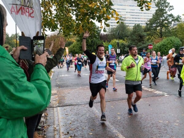 Man enthusiastically running the Royal Parks Half Marathon for SPANA