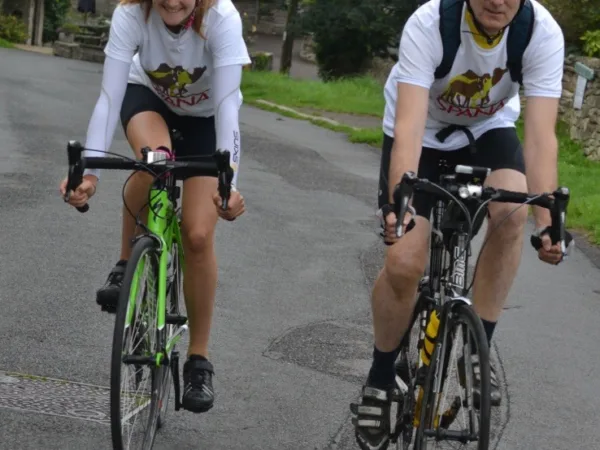 Anna Marie and her dad cycling in SPANA tshirts