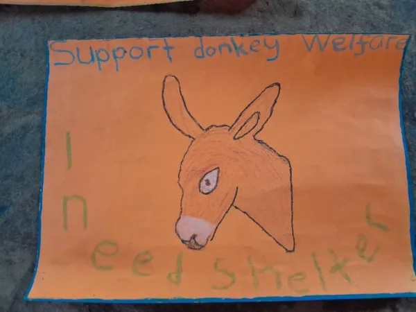 childs drawing with a picture of a donkey and the caption 